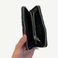 Chrome Hearts wallet inner zip pockets shown open with dual currency compartments and silver hardware.