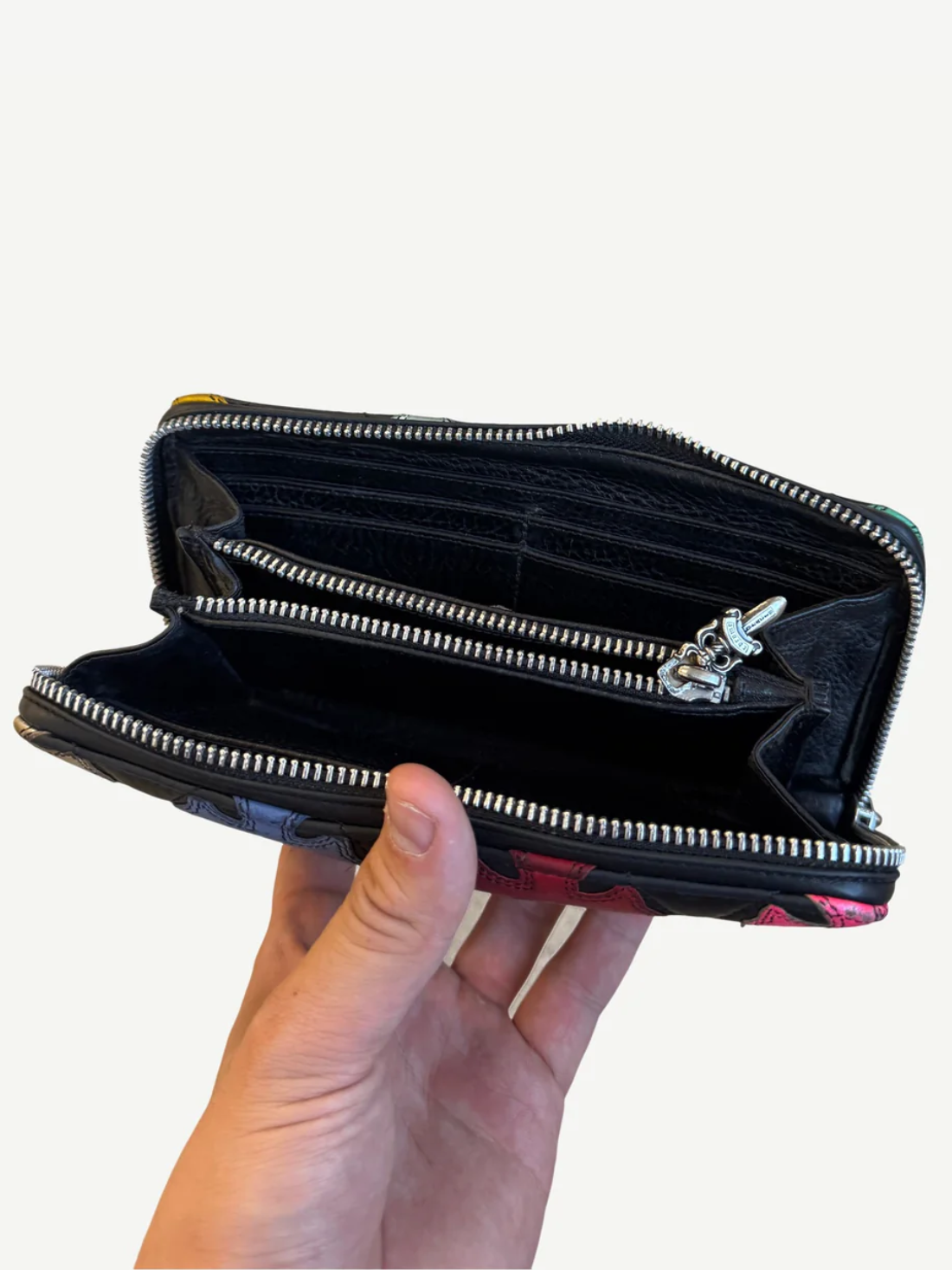 Chrome Hearts long wallet back panel in soft black leather with subtle gothic CH heart stamp logo.