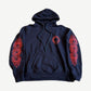 Chrome Hearts navy hoodie front with red horseshoe chest logo and red floral cross prints down both sleeves