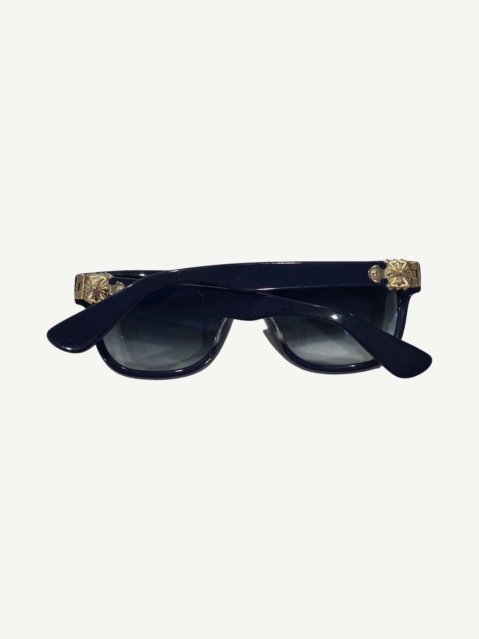 Chrome Hearts Sitonit sunglasses temple detail with engraved logo and silver dagger hinge accent.