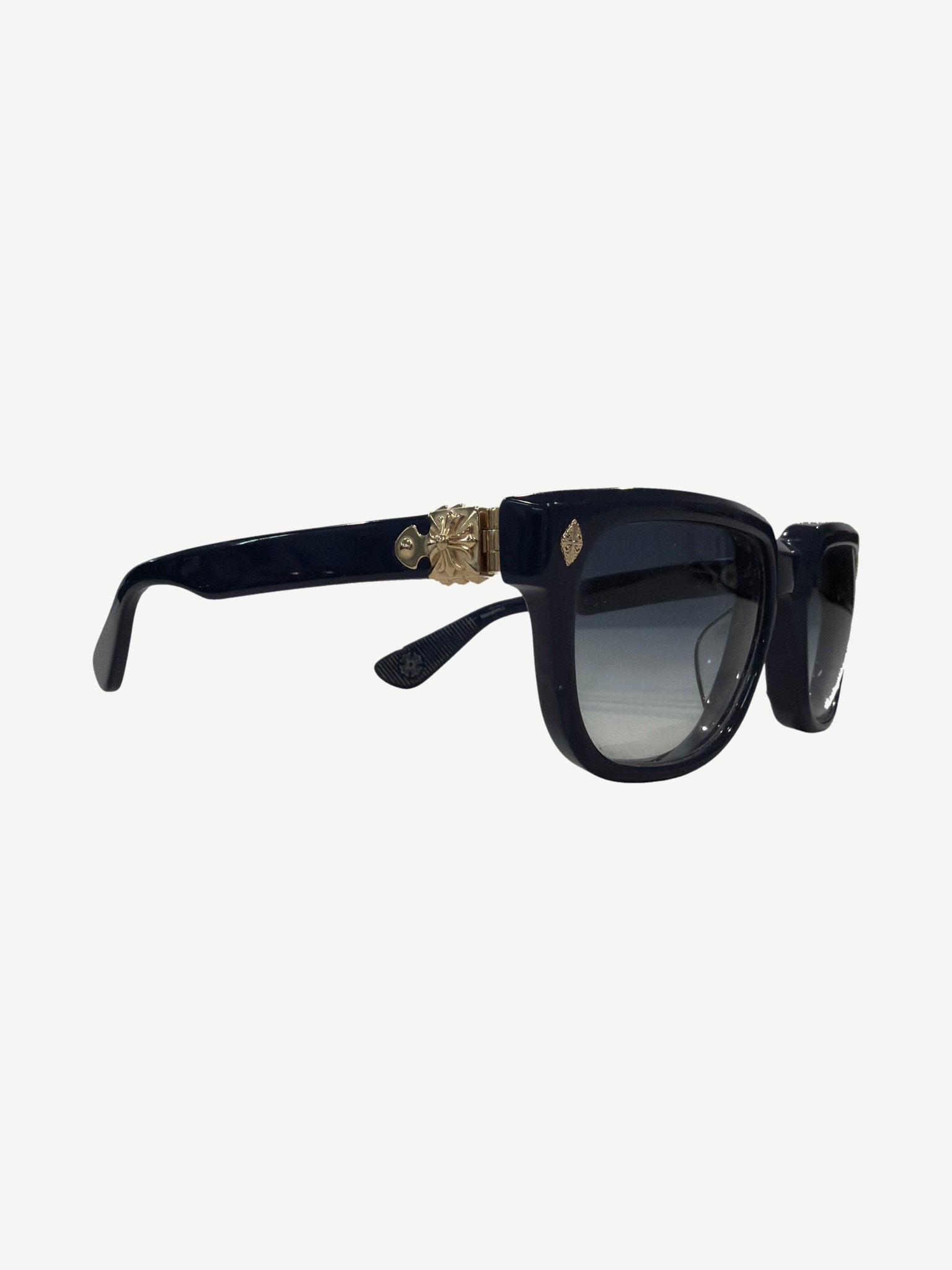 Chrome Hearts Sitonit navy sunglasses angled view showing silver CH cross hardware on temples.