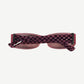Chrome Hearts Matty Boy Ulein sunglasses top view showing pink and black checkerboard temple arms.