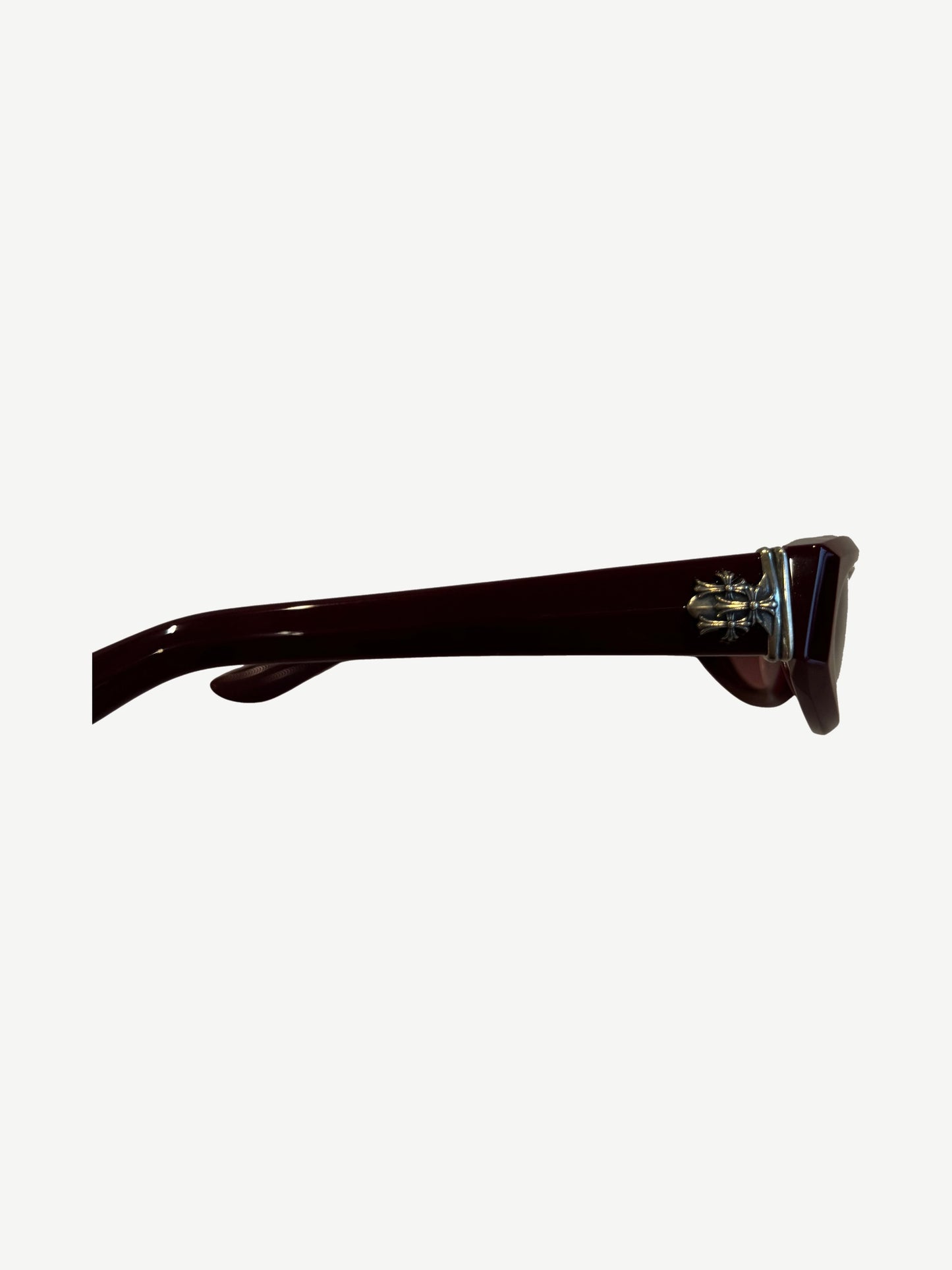 Chrome Hearts Edenbox sunglasses temple detail, burgundy acetate arm with engraved silver Chrome Hearts plaque.