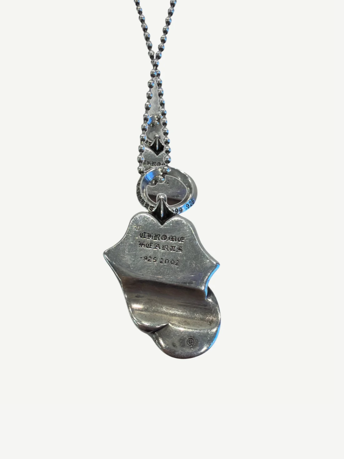 Back of Chrome Hearts Rolling Stones silver pendant with Chrome Hearts 925 2002 hallmark engraving