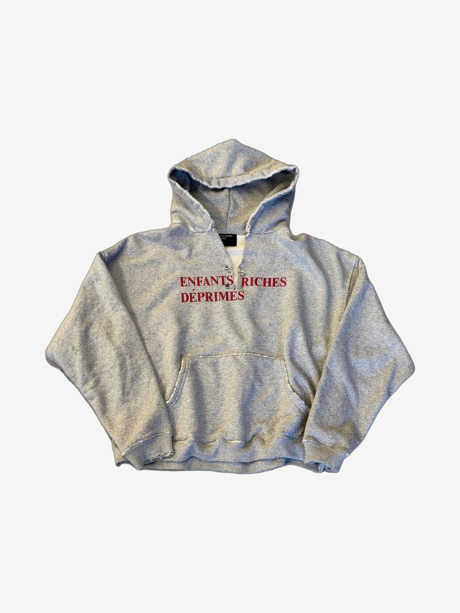 Enfants Riches Deprimes heather gray classic logo pin hoodie with red ERD text and neck pins.