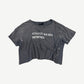 Enfants Riches Deprimes gray cropped tee with white logo print and distressed paint-splattered finish
