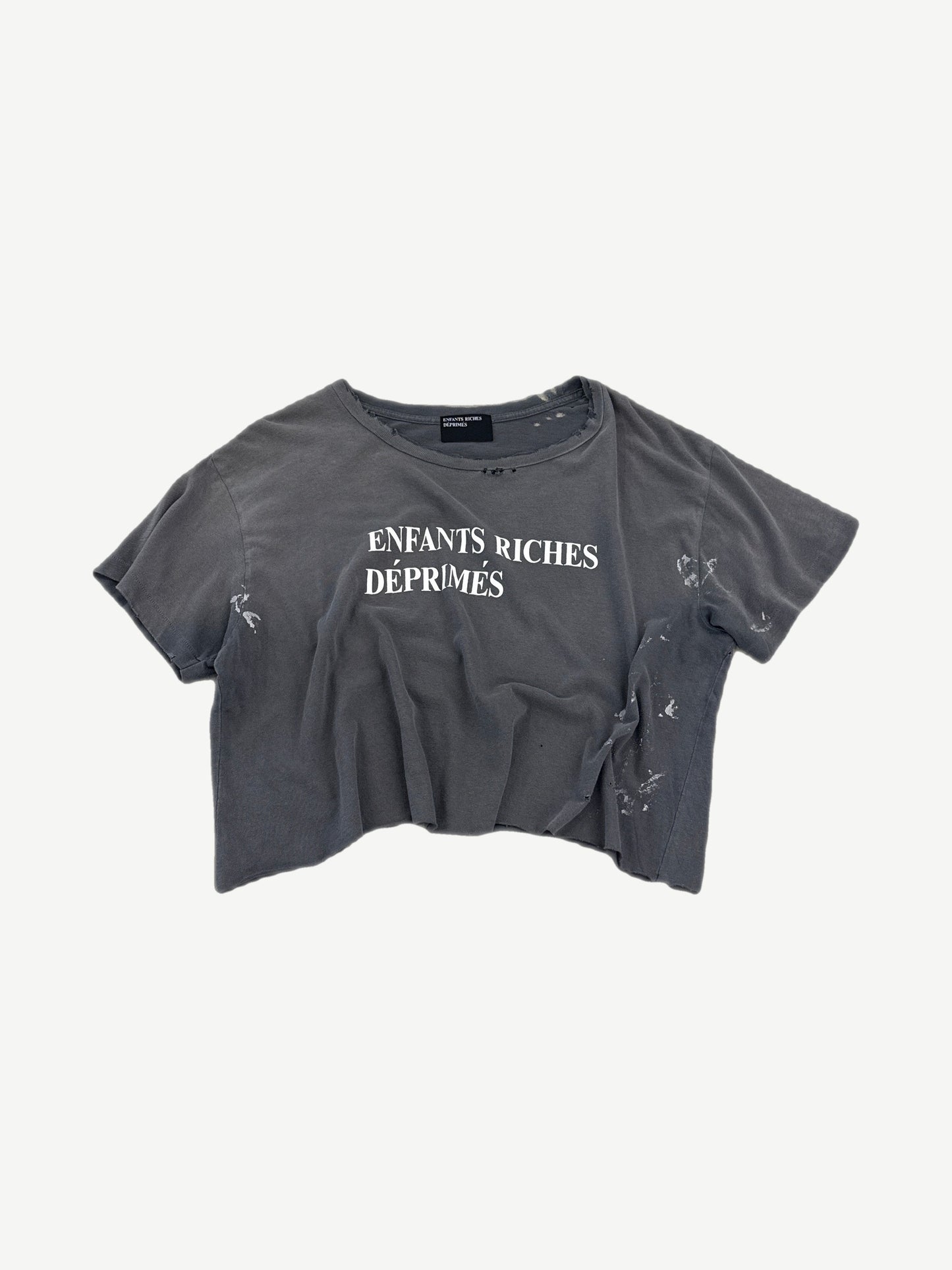 Enfants Riches Deprimes gray cropped tee with white logo print and distressed paint-splattered finish