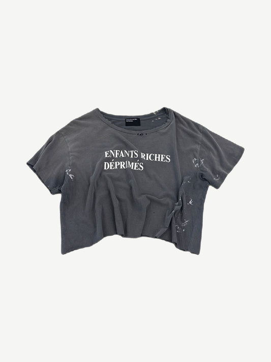 Enfants Riches Deprimes gray cropped tee with white logo print and distressed paint-splattered finish