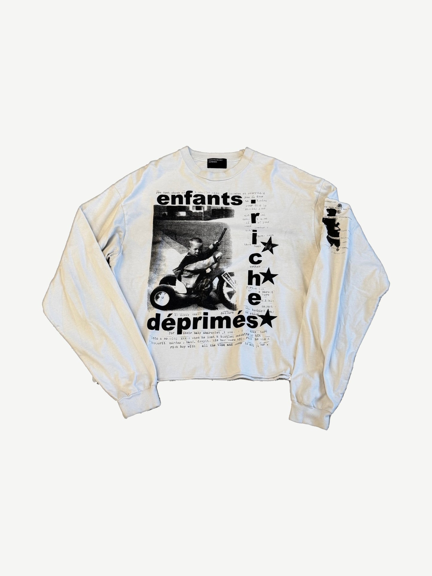 ERD off-white longsleeve front with black tricycle child photo print, typewriter text and Enfants Riches Deprimes logo.