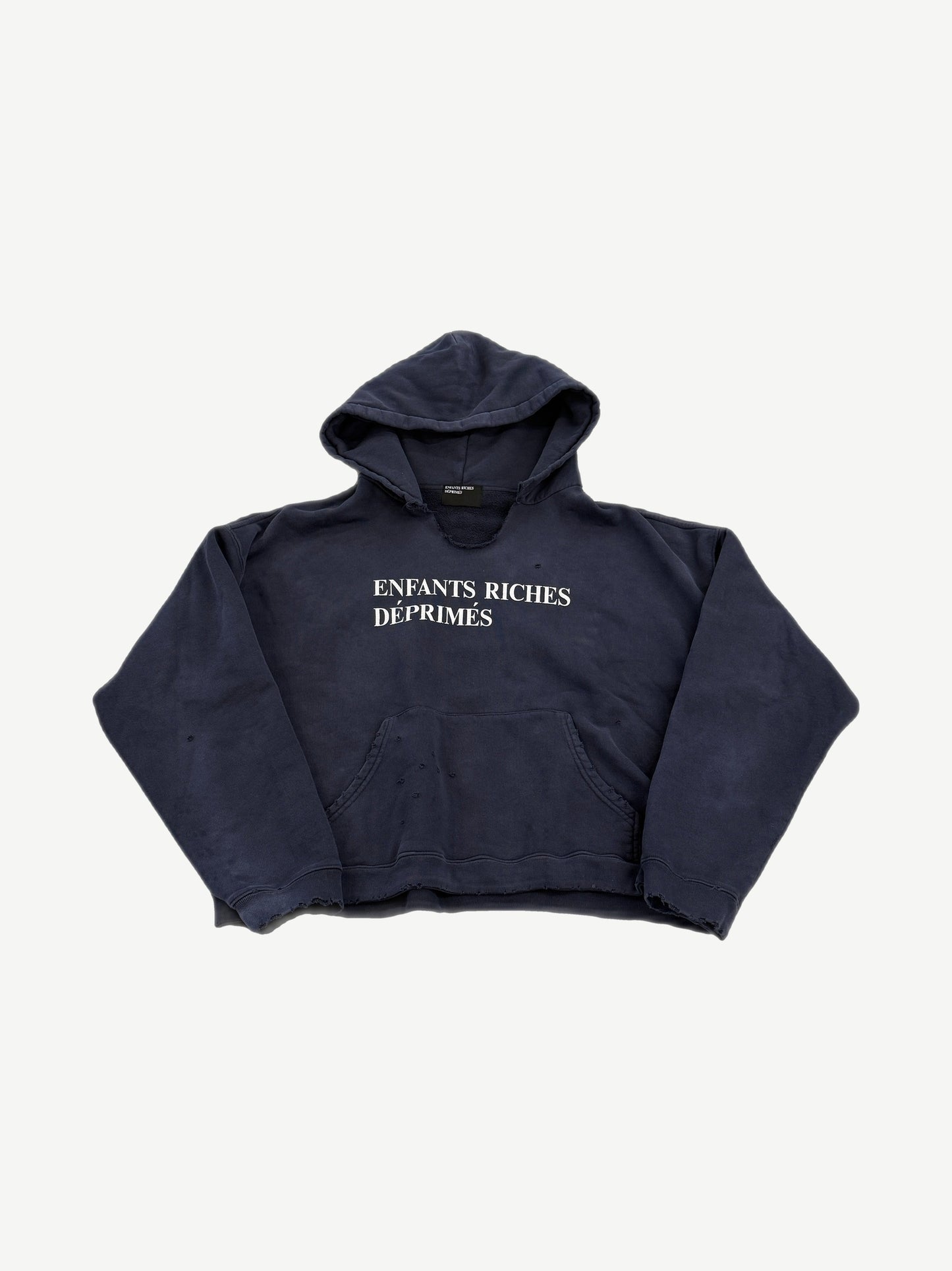 Enfants Riches Deprimes navy distressed hoodie front with white serif logo print and pinhole damage detail