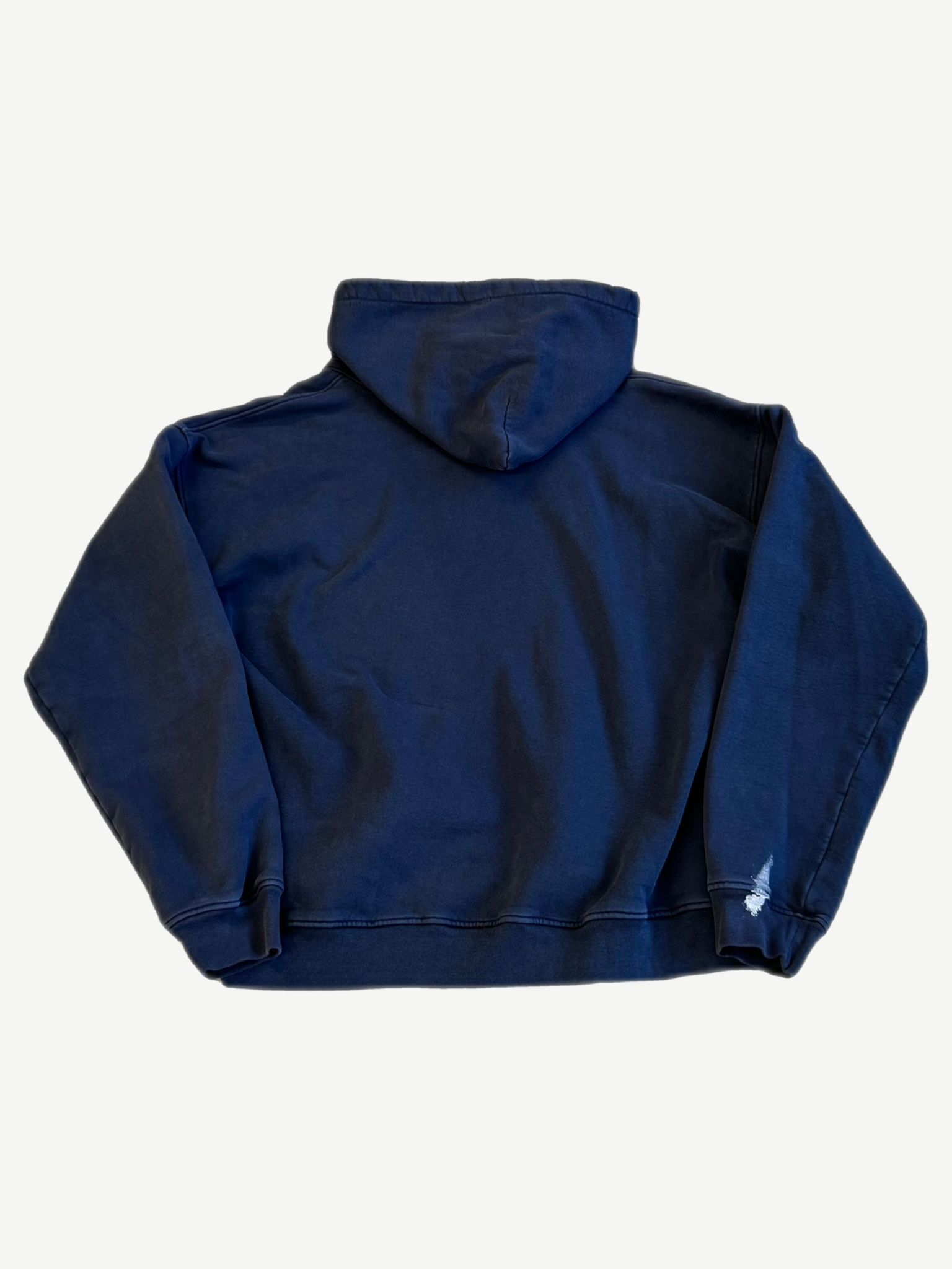 Enfants Riches Deprimes navy Peinture hoodie back with small hand painted white graphic at hem.