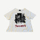 Enfants Riches Deprimes white Vacation tee with cutout newsprint graphic and red ERD script logo.