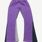 Gallery Dept purple painted flare sweatpants back view, hand-splattered violet streaks across faded grey fleece