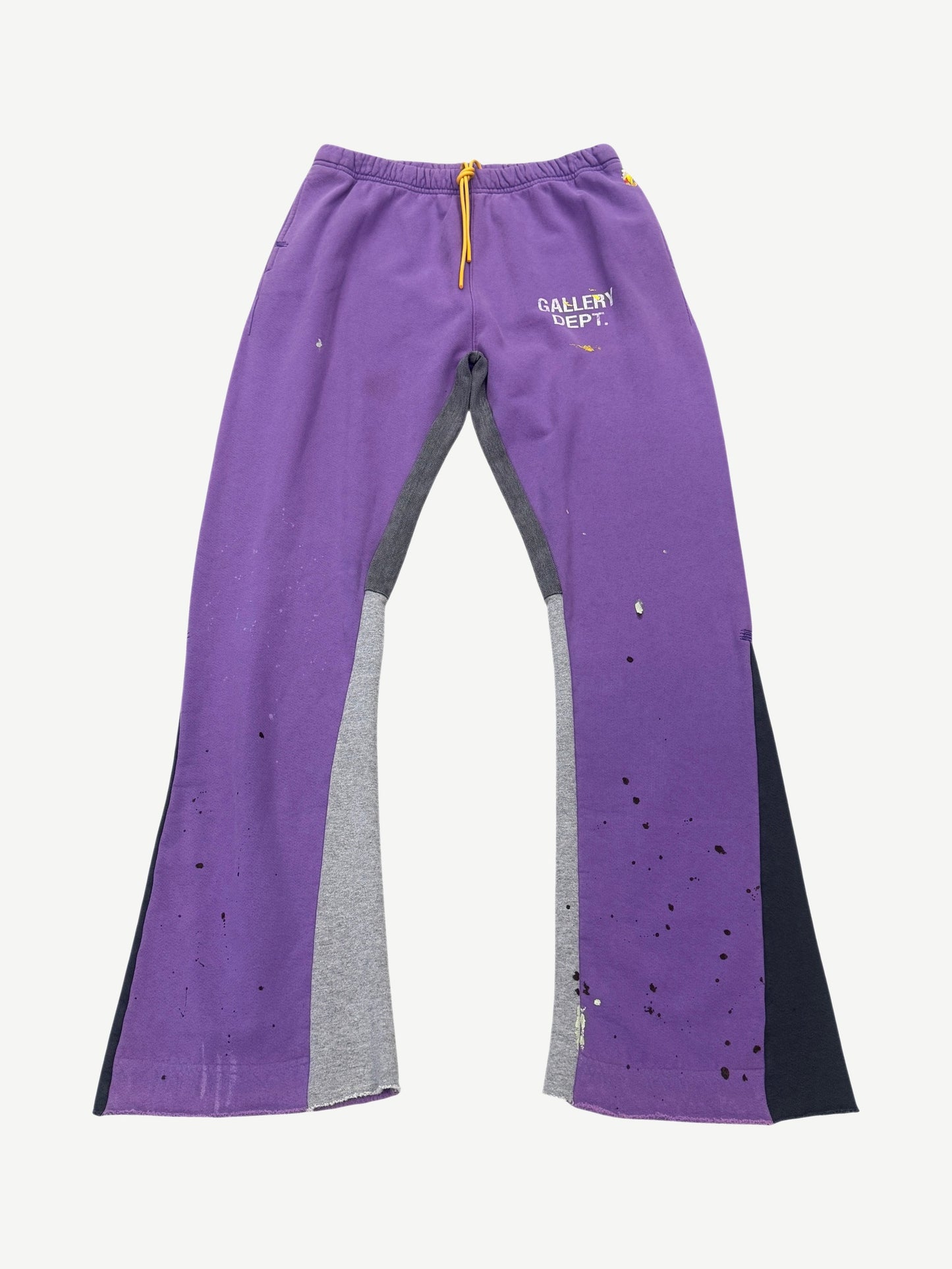 Gallery Dept purple painted flare sweatpants front view, distressed grey base with violet paint splatter streaks