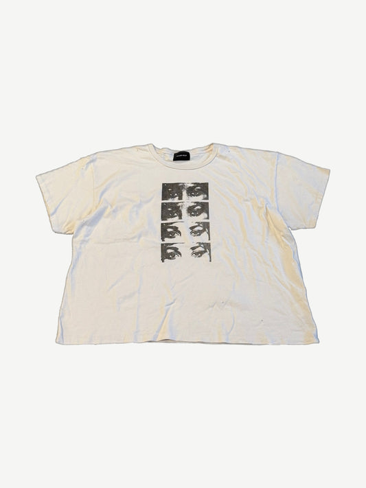 Gallery Hills Brenda's Eyes tee front, cream cotton with stacked black-and-white eye panel print