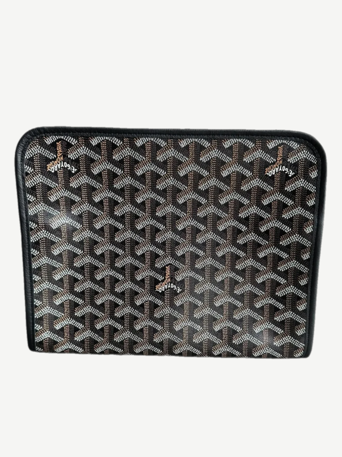Side profile of Goyard black Jouvence GM toiletry pouch showing chevron Goyardine canvas and leather trim.