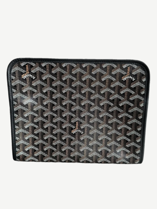 Side profile of Goyard black Jouvence GM toiletry pouch showing chevron Goyardine canvas and leather trim.