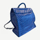 Goyard Saint Leger backpack rear three-quarter view in blue chevron canvas with leather-trimmed shoulder strap