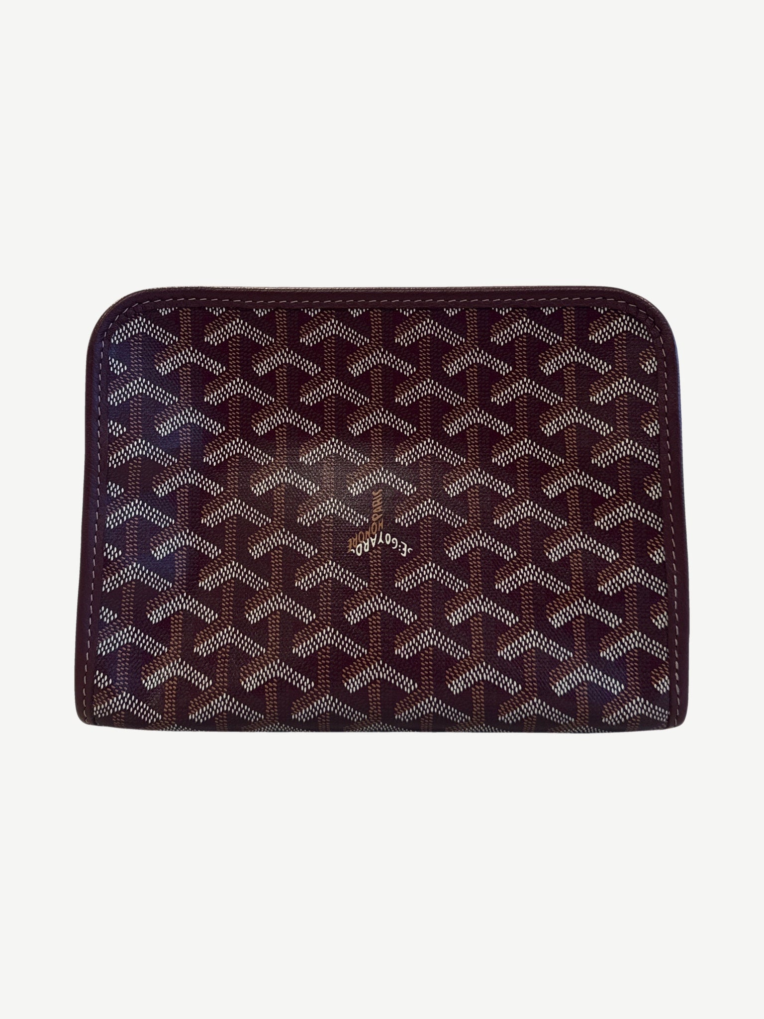 Goyard maroon Jouvence PM pouch side angle showing chevron Y print, leather trim and pull tab.