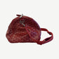 Goyard Boeing 45 red duffle side profile showing chevron canvas, silver hardware zip pull and adjustable strap