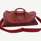 Goyard red Boeing 45 duffle with detachable woven shoulder strap and red leather trim accents