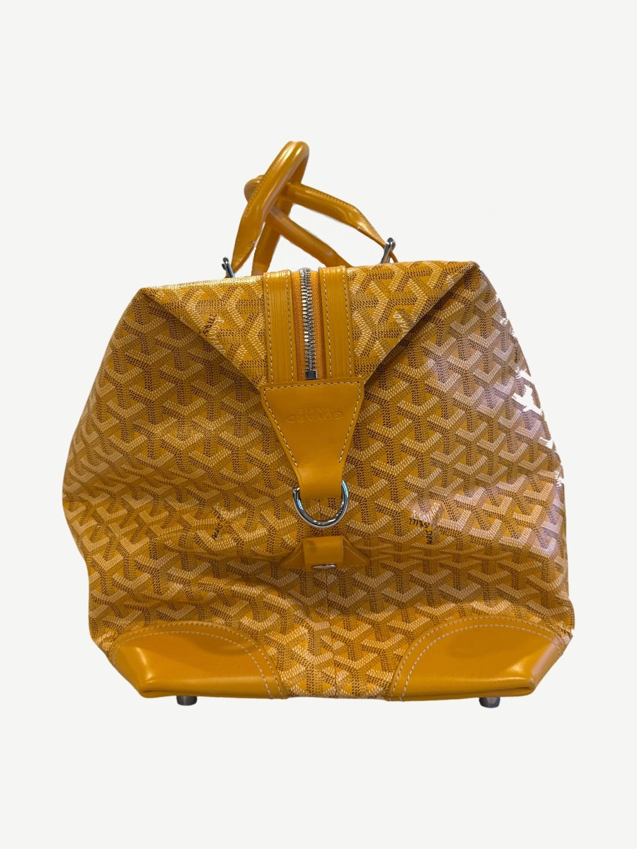 Goyard Boeing 45 yellow duffle bag end view with zipper closure, D-ring and yellow leather corner caps