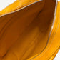 Interior view of Goyard yellow Cap Vert messenger bag showing bright yellow lining and zip pocket
