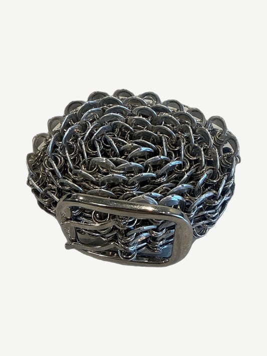 Greedy Unit bottle cap belt coiled showing rosette pattern of interlocking silver bottle cap rings