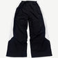 Back of GV Gallery Raspberry Hills black tuxedo sweatpants with contrast tuxedo stripe down each leg.