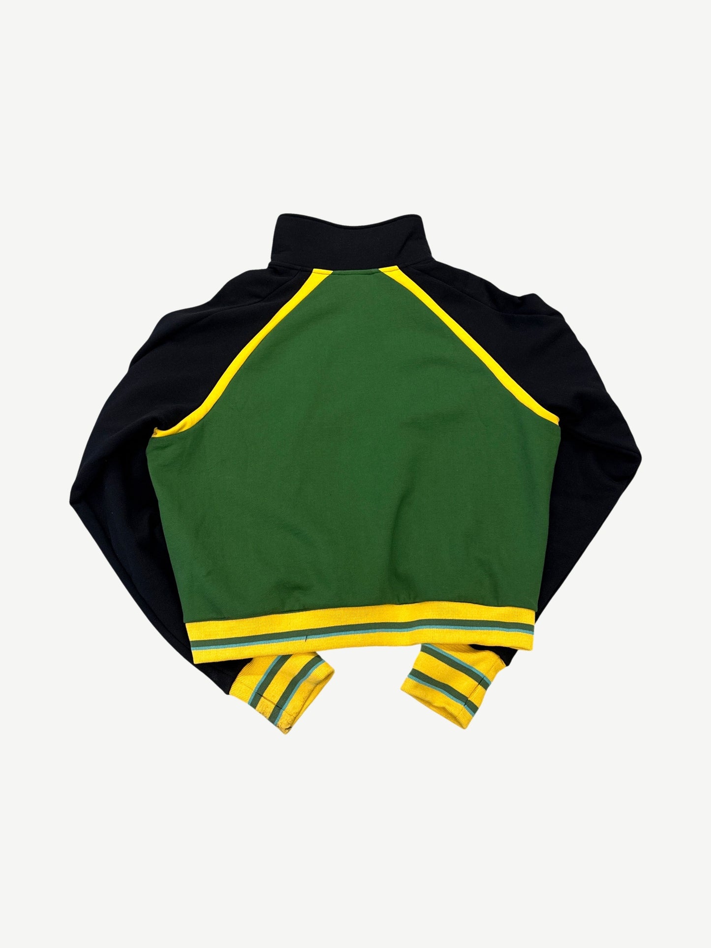 Back of Raspberry Hills cropped Jamaican track jacket showing green panel with yellow striped cuffs and hem.