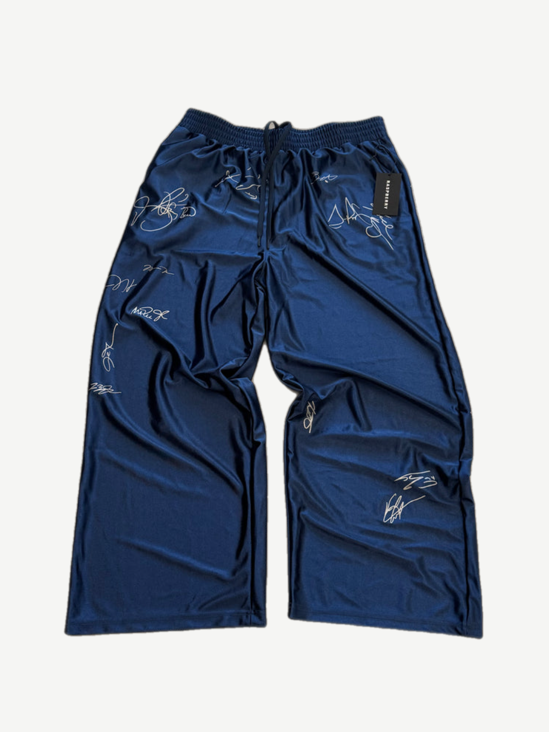 GV Gallery navy satin signature sweatpants front with allover white printed celebrity signatures.