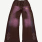 HMDD brown flared sweatpants with rainbow rhinestone studs along legs and faded sun-bleached panels.