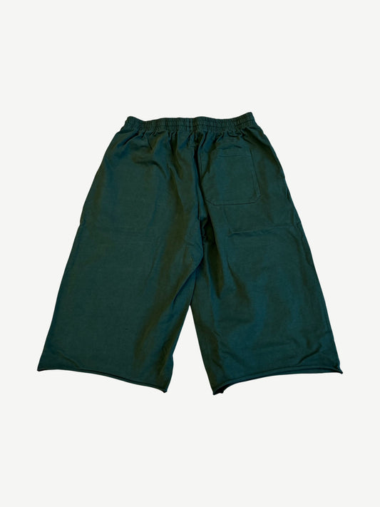 Back of HMDD green Program 3/4 sweat shorts with single right patch pocket and elastic drawstring waist
