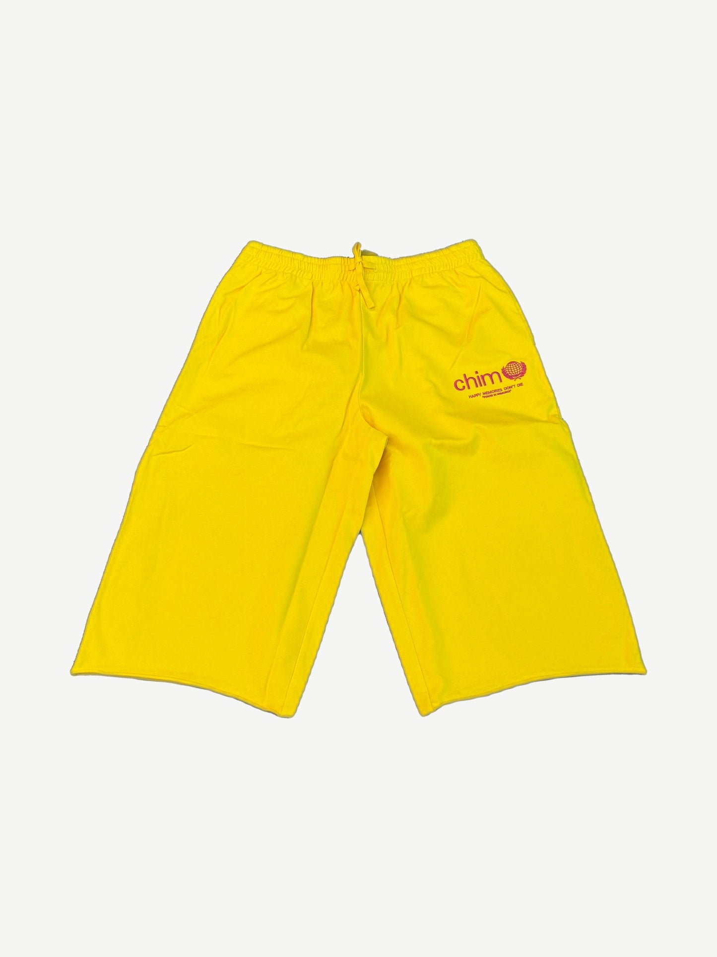 HMDD Program yellow long sweat shorts front with pink chim globe logo and drawcord elastic waistband.