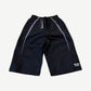 HMDD Juggernaut black nylon shorts front with grey side stripes, drawcord waist and HMDD logo at hem.