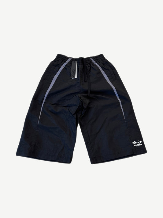 HMDD Juggernaut black nylon shorts front with grey side stripes, drawcord waist and HMDD logo at hem.