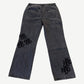 HMDD gray patch pants back view with black HMDD monogram embroidered patches concentrated on left lower leg.