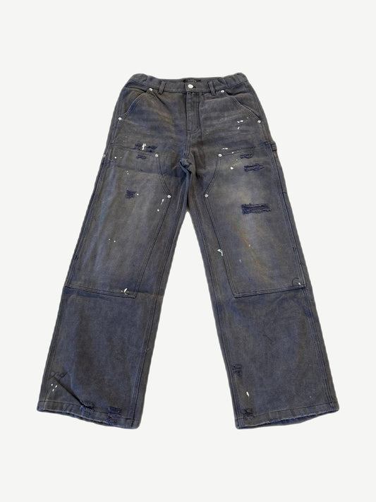 HMDD grime washed carpenter work pants in faded navy with paint splatters and distressed knee panels