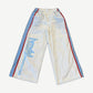 HMDD Luxembourg nylon sweatpants front, white wide-leg track pants with blue side panel piping