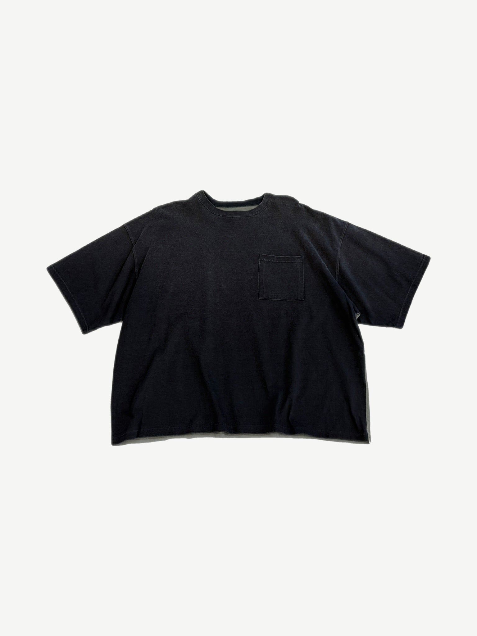 Kapital two-tone pocket tee front, faded black body with chest pocket and dropped shoulders.