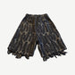 Kapital Magpie denim shorts back view with feather print pattern and wide raw fringed hem detail.