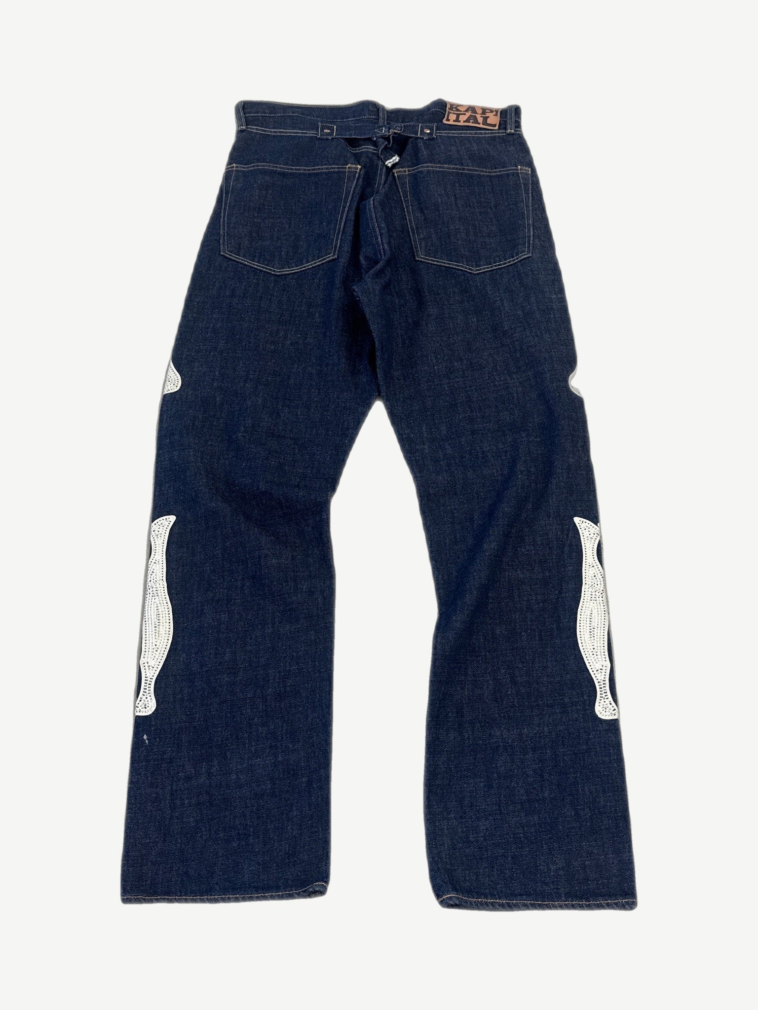 Kapital raw indigo bone denim back view showing dark wash, bone print detail and standard rear pockets.