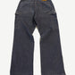 Louis Vuitton gray denim jeans rear view with monogram pocket flaps and leather LV logo patch
