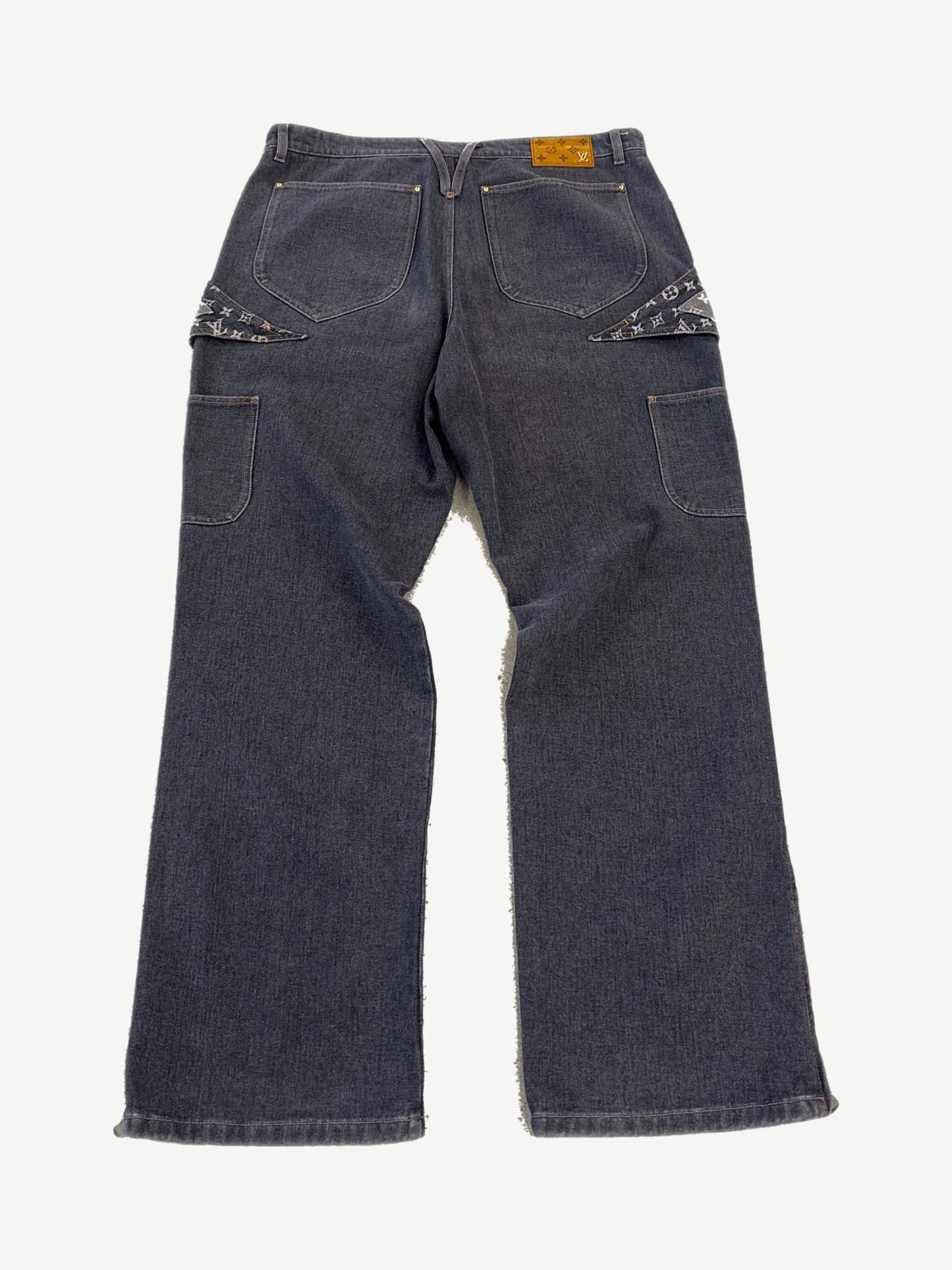 Louis Vuitton gray denim jeans rear view with monogram pocket flaps and leather LV logo patch