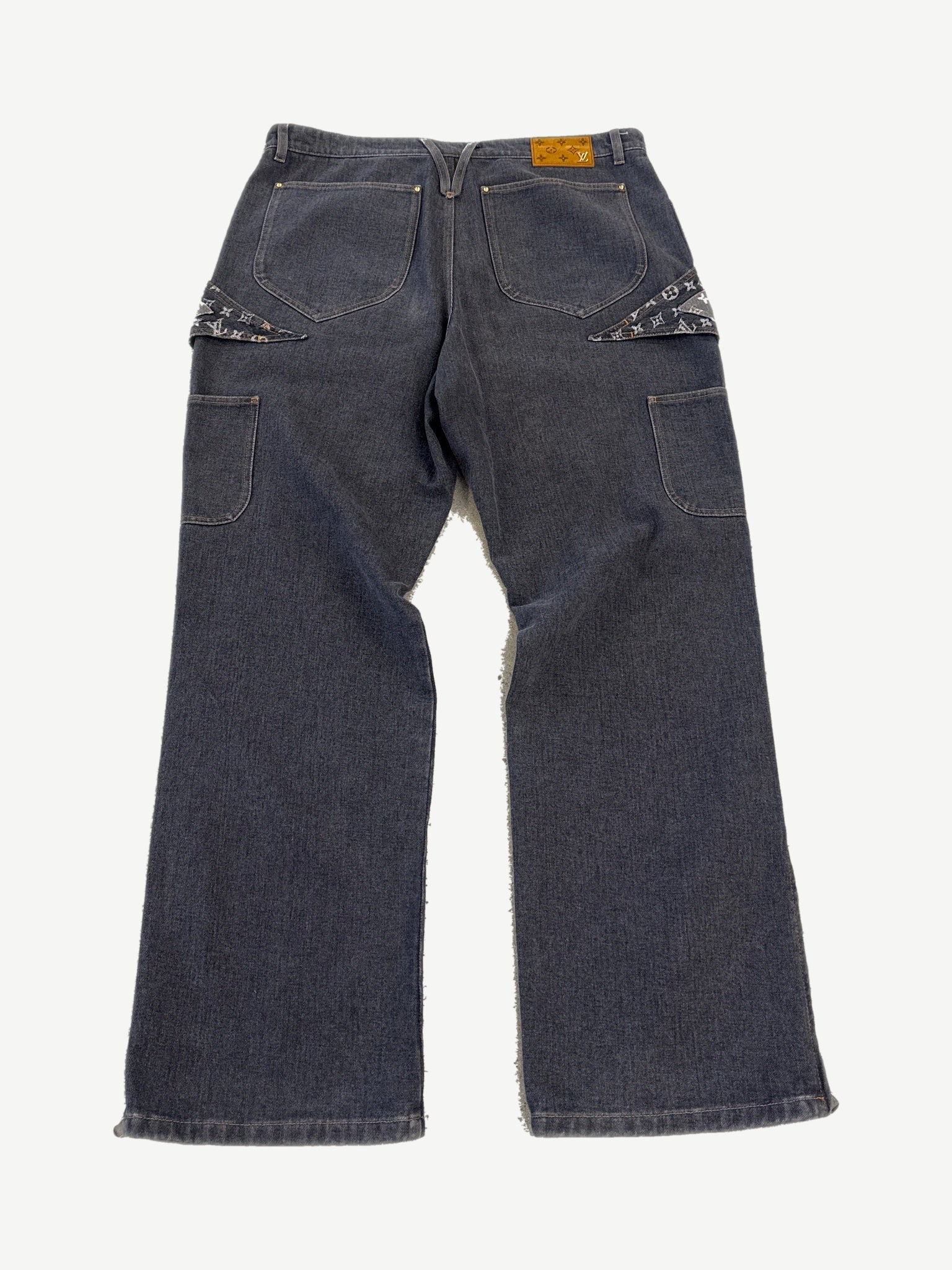 Louis Vuitton gray denim jeans rear view with monogram pocket flaps and leather LV logo patch