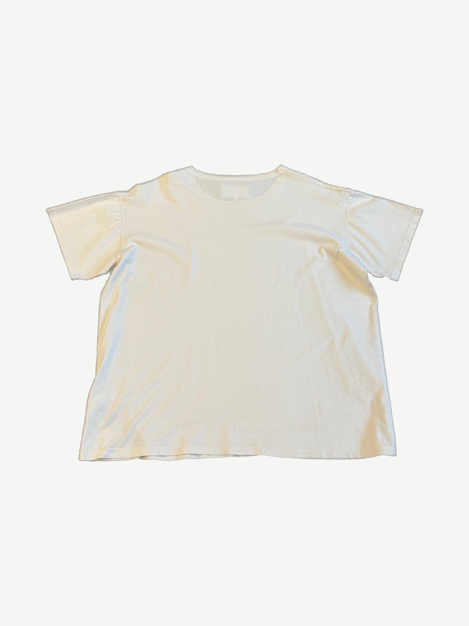 Maison Margiela stamp logo tee back view, blank cream cotton panel with signature white tag stitch