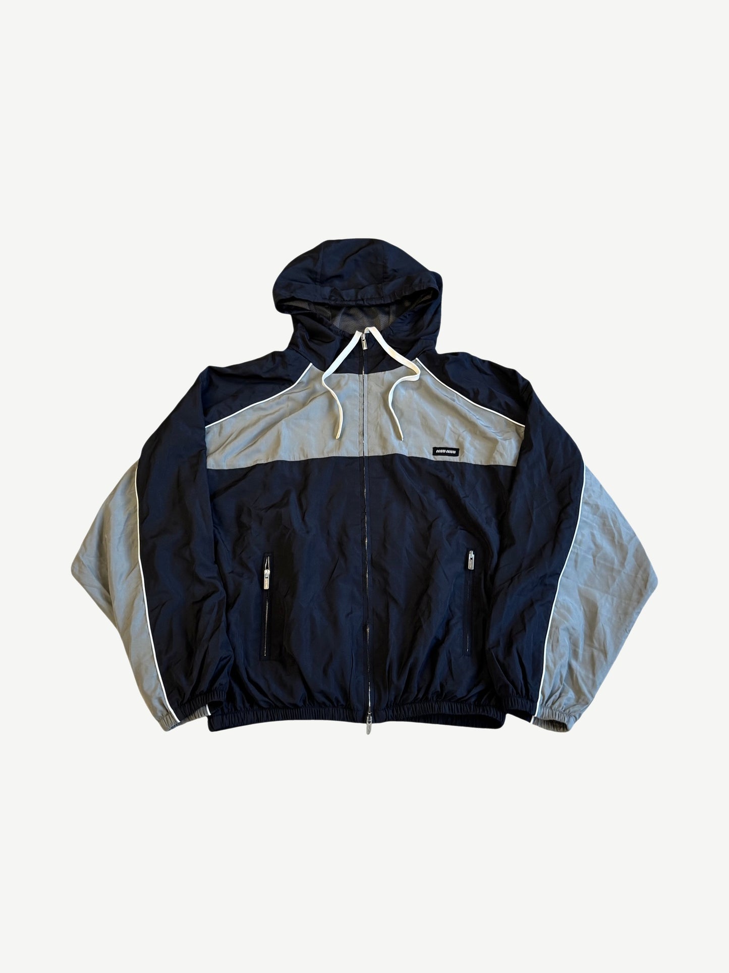 Miu Miu technical silk zip blouson front in navy and grey with white piping and small woven chest label