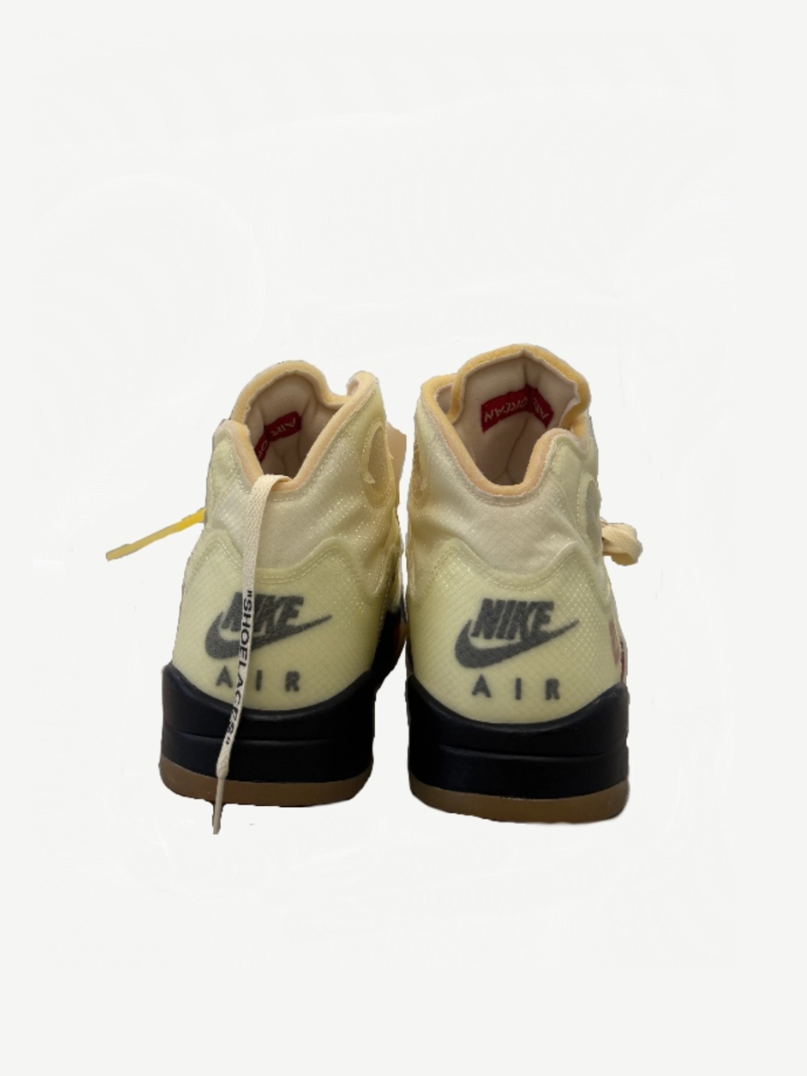 Off-White Jordan 5 Sail rear view showing Nike Air heel branding, black midsole stripe and gum sole