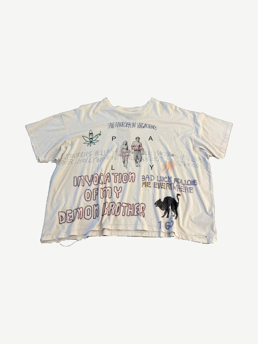 Paly Hollywood off-white distressed tee front with PALY text, black cat, Invocation of My Demon Brother bedazzled graphic.
