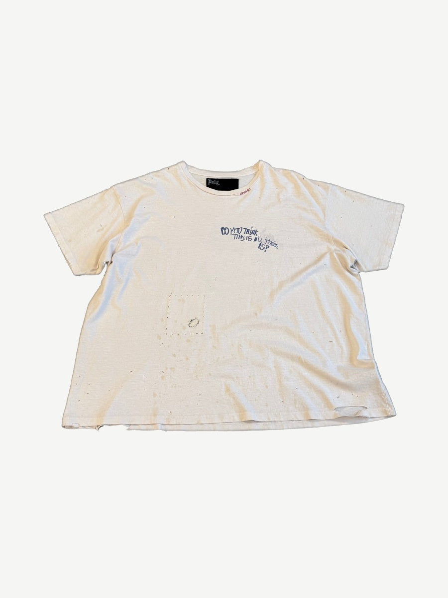 Paly Hollywood Elvis Mon Amor cream distressed tee with blue chest scribble text and pinholes, front view